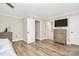 Bright main bedroom features wood floors, neutral paint, an ensuite bathroom, and a ceiling fan at 2780 China Grove Rd, Kannapolis, NC 28083