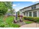 Secluded backyard featuring a well-manicured lawn, colorful flowerbeds, and an inviting seating area with mature trees at 3022 8Th Street Ne Ct, Hickory, NC 28601