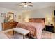 Bedroom featuring a large dresser, bedside tables, and a bench at the foot of the bed at 3022 8Th Street Ne Ct, Hickory, NC 28601