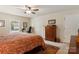 Cozy bedroom with carpet, featuring two closets, a ceiling fan, and a window overlooking the neighborhood at 3022 8Th Street Ne Ct, Hickory, NC 28601