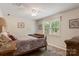 Cozy bedroom featuring a comfortable bed, soft lighting, and a scenic window view for a peaceful retreat at 3022 8Th Street Ne Ct, Hickory, NC 28601