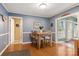 Formal dining room with wood floors, wainscoting, and natural light at 3022 8Th Street Ne Ct, Hickory, NC 28601
