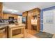 Bright kitchen has wood cabinets, stainless steel refrigerator, granite counters, and a built-in desk area at 3022 8Th Street Ne Ct, Hickory, NC 28601