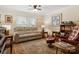 Cozy living room featuring a neutral sofa and a comfy armchair, great for relaxation and casual conversation at 3022 8Th Street Ne Ct, Hickory, NC 28601
