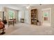 Inviting living room with a bookshelf and two entryways, providing ample space and natural light at 3022 8Th Street Ne Ct, Hickory, NC 28601