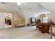 Open living room featuring a crib, TV area, and comfortable seating, perfect for relaxation and Gathering time at 3022 8Th Street Ne Ct, Hickory, NC 28601