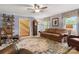 Relaxing living room with an open staircase and a grandfather clock, creating a warm and welcoming atmosphere at 3022 8Th Street Ne Ct, Hickory, NC 28601