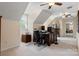 Spacious office area featuring a vaulted ceiling, a built-in desk, and ample natural light from a nearby window at 3022 8Th Street Ne Ct, Hickory, NC 28601