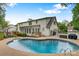 Large backyard pool area with a spacious pool, a patio and comfortable seating, perfect for outdoor gatherings at 3022 8Th Street Ne Ct, Hickory, NC 28601