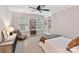 Bright bedroom featuring built-in shelving and comfortable seating area at 3203 Blackburn Dr, Waxhaw, NC 28173