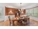 Formal dining room features decorative wallpaper, a chandelier, and views of the outside at 3203 Blackburn Dr, Waxhaw, NC 28173