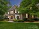 Charming two-story brick home with lush landscaping and an inviting entrance at 3203 Blackburn Dr, Waxhaw, NC 28173