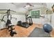 Home gym with an elliptical machine, a weight machine, and a yoga mat at 3203 Blackburn Dr, Waxhaw, NC 28173