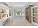 Bright home office featuring built-in shelving, desk, and large windows at 3203 Blackburn Dr, Waxhaw, NC 28173