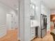 Bright kitchen features white cabinets, stainless steel refrigerator, and wine storage at 3203 Blackburn Dr, Waxhaw, NC 28173