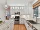 Bright kitchen with white cabinets, granite countertops, and stainless steel appliances at 3203 Blackburn Dr, Waxhaw, NC 28173