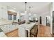 Modern kitchen featuring an island with barstool seating and views of the living room at 3203 Blackburn Dr, Waxhaw, NC 28173