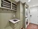 Laundry room includes a sink, washer, dryer, and tile floor at 3203 Blackburn Dr, Waxhaw, NC 28173