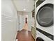 Laundry Room showcasing stackable washer and dryer set with subway tile back splash at 3203 Blackburn Dr, Waxhaw, NC 28173