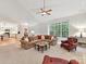 Open-concept living room with large windows, comfortable seating, and stylish decor at 3203 Blackburn Dr, Waxhaw, NC 28173