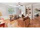Comfortable living area featuring built-in shelving, a desk, and natural light at 3203 Blackburn Dr, Waxhaw, NC 28173