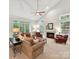 Bright living room featuring a fireplace, vaulted ceiling, and large windows at 3203 Blackburn Dr, Waxhaw, NC 28173