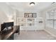 Bright office area boasts custom built-ins, neutral carpet, and ample natural light at 3203 Blackburn Dr, Waxhaw, NC 28173