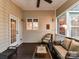 Relaxing screened porch with comfortable seating, glass table, ceiling fan, and views of backyard at 3203 Blackburn Dr, Waxhaw, NC 28173