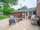 Relaxing back patio with outdoor seating and stainless steel barbeque grill at 3313 Lancaster Hwy, Monroe, NC 28112