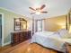 The bedroom features a four-poster bed, wood floors, and a large dresser with mirror at 3313 Lancaster Hwy, Monroe, NC 28112