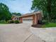 Attached brick garage with a side entrance and durable driveway at 3313 Lancaster Hwy, Monroe, NC 28112