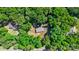 Aerial view of a home with a large yard surrounded by dense, mature trees at 3317 Treyburn Dr, Midland, NC 28107