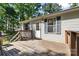 Back porch area with a door leading to the residence and features a wood porch and steps at 3317 Treyburn Dr, Midland, NC 28107