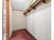 Walk-in closet featuring carpeted floor and ample storage shelving at 3317 Treyburn Dr, Midland, NC 28107