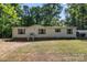 Charming single-story home featuring vinyl siding, green shutters, and a well-maintained front yard at 3317 Treyburn Dr, Midland, NC 28107