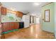 Cozy kitchen featuring wood cabinets, black appliances, and an open design to the living area at 3317 Treyburn Dr, Midland, NC 28107
