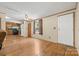 Inviting space featuring hardwood floors seamlessly connecting the living room and kitchen at 3317 Treyburn Dr, Midland, NC 28107