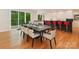 Dining room featuring a large table, modern chairs, and access to outdoor views at 3385 Rainbow Dr # 7A, Marvin, NC 28173