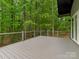 Large deck perfect for outdoor entertaining with cable railing offers private views of lush greenery at 3385 Rainbow Dr # 7A, Marvin, NC 28173