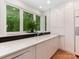 Contemporary kitchen featuring sleek, modern cabinets, quartz countertops, and large windows at 3385 Rainbow Dr # 7A, Marvin, NC 28173