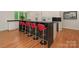 Modern kitchen with white cabinets, black countertops, stainless appliances, and counter seating at 3385 Rainbow Dr # 7A, Marvin, NC 28173