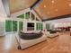 Bright, open living area with expansive windows, hardwood floors, and a modern design aesthetic at 3385 Rainbow Dr # 7A, Marvin, NC 28173