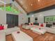 Open living room features hardwood floors, vaulted wood ceilings, and modern lighting at 3385 Rainbow Dr # 7A, Marvin, NC 28173