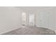 A carpeted bedroom shows entrances to the primary bathroom and walk-in closet at 356 Bly St, Rock Hill, SC 29732