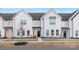 Beautiful, modern townhome exterior with white siding, a black door, and professionally landscaped front yard at 356 Bly St, Rock Hill, SC 29732