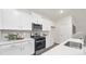 This contemporary kitchen features stainless steel appliances, white cabinets, and white quartz countertops at 356 Bly St, Rock Hill, SC 29732