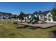 Community playground with slides and play structures next to new homes at 356 Bly St, Rock Hill, SC 29732