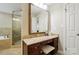 Bathroom with granite vanity, tiled floors, soaking tub and a glass enclosed shower at 3804 Bellingham Ln, Charlotte, NC 28215
