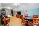 Bright and airy bonus room featuring a round table, chairs, and entertainment center at 3804 Bellingham Ln, Charlotte, NC 28215