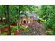 Beautiful brick home featuring mature landscaping, a black door, and black shutters at 3804 Bellingham Ln, Charlotte, NC 28215